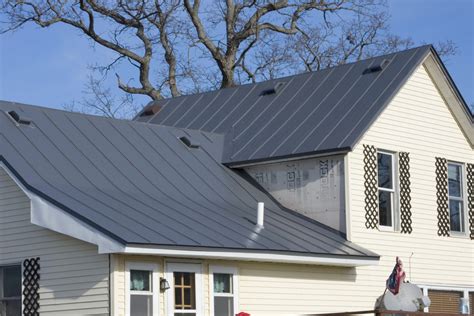 charcoal grey metal roof on blue house|dark grey metal roof.